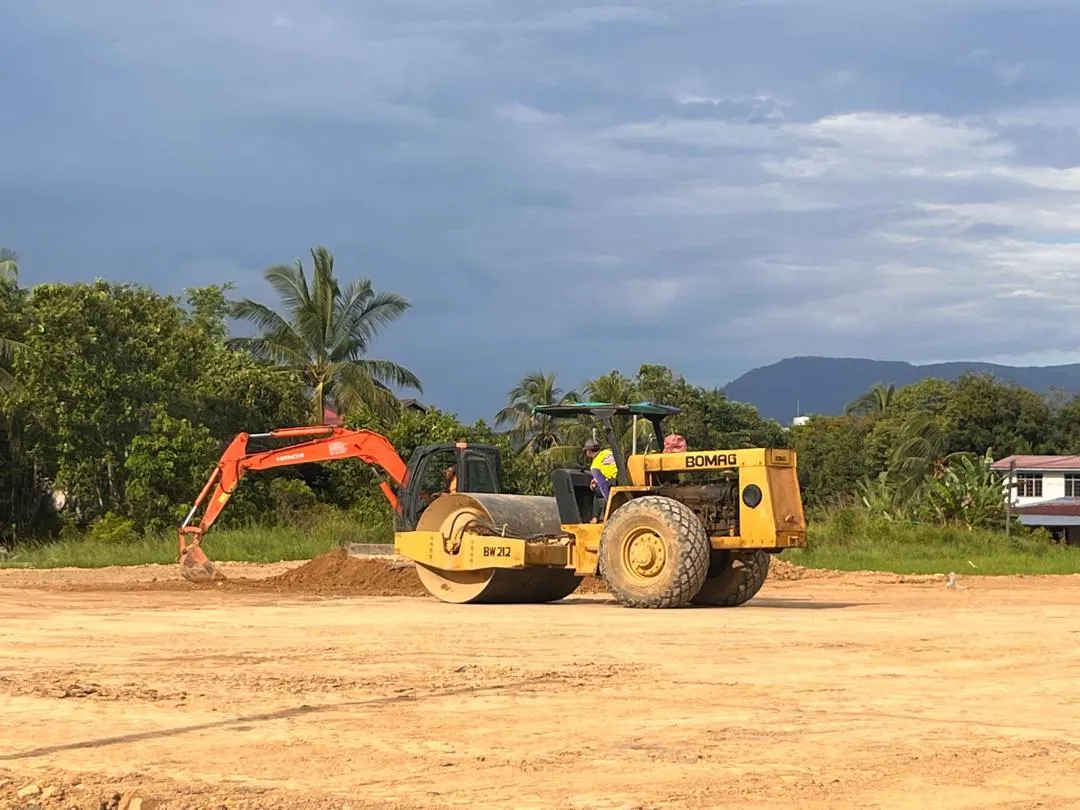 Roller compacting a cleared site ahead of construction